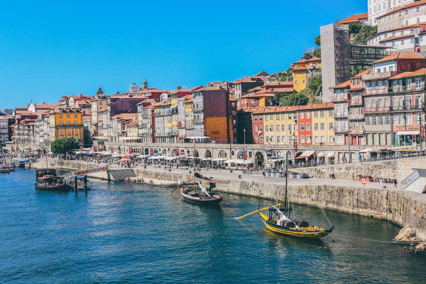 Riverside buildings and traditional boats along the Douro in Porto, Portugal