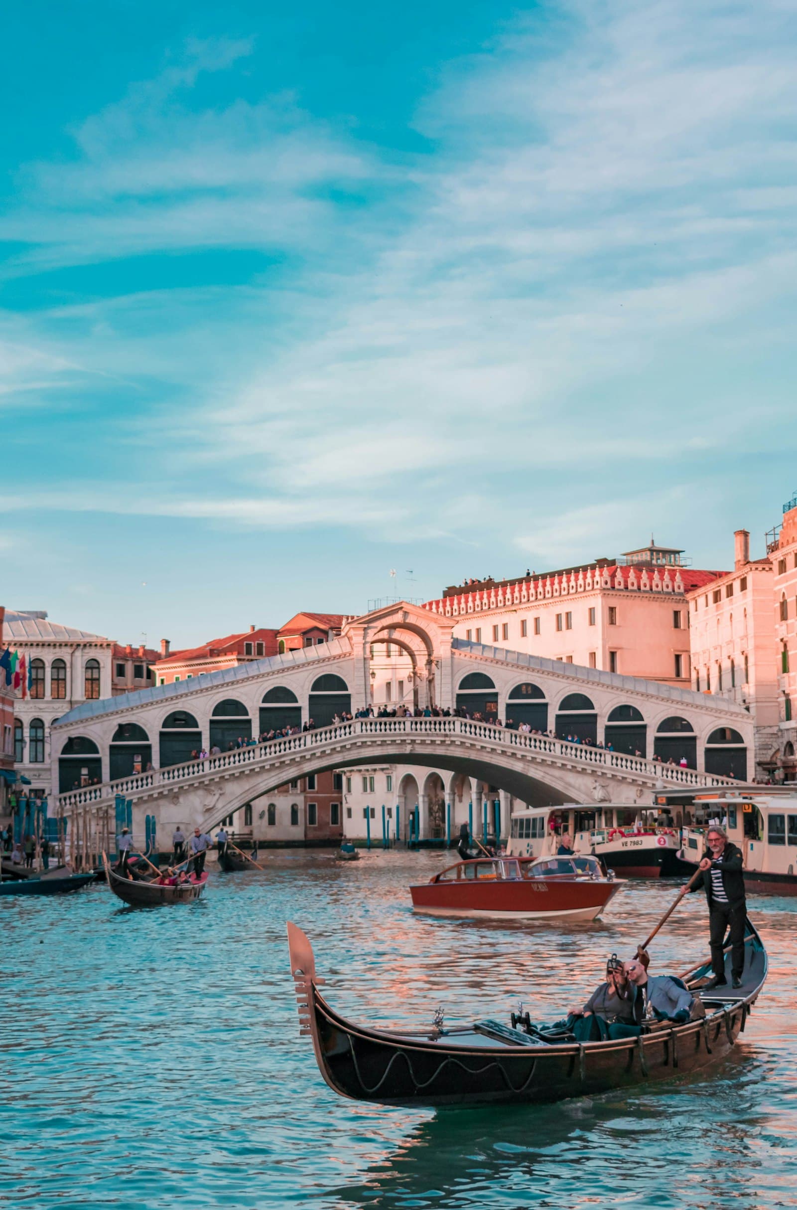 A gondola on the Grand Canal in front of the Rialto Bridge